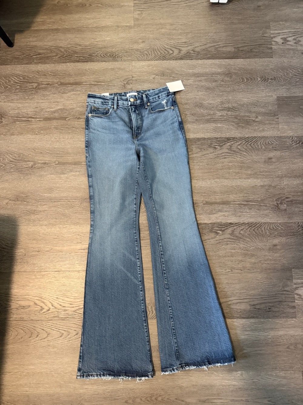 Good American Light Blue Flare Jeans with Raw Hem